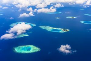 A breathtaking aerial view of tropical islands and azure blue waters, showcasing stunning natural beauty.