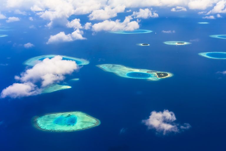 A breathtaking aerial view of tropical islands and azure blue waters, showcasing stunning natural beauty.